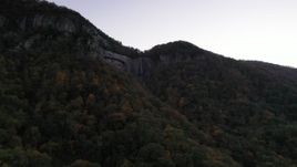 2.7K stock footage aerial video fly toward a waterfall at sunset, Chimney Rock, North Carolina Aerial Stock Footage | CAP_014_010