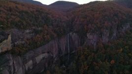 2.7K stock footage aerial video fly away from forest and a clifftop waterfall at sunset, Chimney Rock, North Carolina Aerial Stock Footage | CAP_014_020