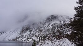 4K stock footage aerial video of snowy mountain slopes beside lake in Inyo National Forest, California Aerial Stock Footage | CAP_015_001