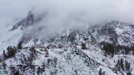 4K stock footage aerial video of passing by a snowy mountain in the Sierra Nevadas, Inyo National Forest, California Aerial Stock Footage | CAP_015_027