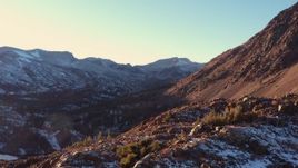 4K stock footage aerial video fly over rocky slope for wide view of mountain valley at sunset, Inyo National Forest, California Aerial Stock Footage | CAP_015_032