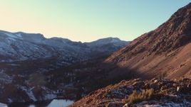 4K stock footage aerial video fly away from mountain valley at sunset, Inyo National Forest, California Aerial Stock Footage | CAP_015_034