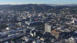 HD stock footage aerial video orbit apartment and college with view of office buildings in Hollywood, California Aerial Stock Footage | CAP_016_009