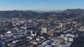HD stock footage aerial video of flying away from office and city buildings in Hollywood, California Aerial Stock Footage | CAP_016_016