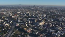 HD stock footage aerial video orbit Hollywood with a view of the Downtown Los Angeles skyline, California Aerial Stock Footage | CAP_016_019