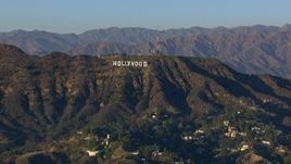 HD stock footage aerial video of flying by the Hollywood Sign in Los Angeles, California Aerial Stock Footage | CAP_016_030