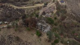 HD stock footage aerial video of orbiting homes destroyed by fire, Malibu, California Aerial Stock Footage | CAP_018_006