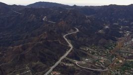 HD stock footage aerial video of mountains and road scarred by fire, Malibu, California Aerial Stock Footage | CAP_018_013