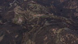HD stock footage aerial video of approaching hillside homes destroyed by fire, Malibu, California Aerial Stock Footage | CAP_018_022