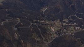 HD stock footage aerial video reverse view of hillside homes destroyed by fire, Malibu, California Aerial Stock Footage | CAP_018_026