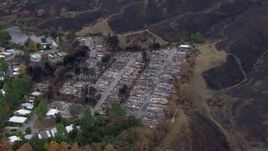 HD stock footage aerial video of orbiting a neighborhood destroyed by fire, Malibu, California Aerial Stock Footage | CAP_018_030