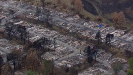 HD stock footage aerial video of circling a neighborhood destroyed by fire, Malibu, California Aerial Stock Footage | CAP_018_031