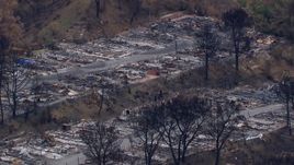 HD stock footage aerial video of a reverse view of a neighborhood devastated by fire, Malibu, California Aerial Stock Footage | CAP_018_035