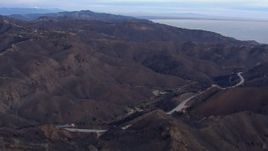 HD stock footage aerial video of mountains scorched by fire, Malibu, California Aerial Stock Footage | CAP_018_041