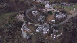 HD stock footage aerial video a bird's eye view and orbit of homes destroyed by fire, Malibu, California Aerial Stock Footage | CAP_018_046