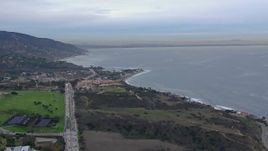 HD stock footage aerial video of approaching oceanfront homes in Malibu at sunset, California Aerial Stock Footage | CAP_018_049