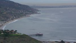 HD stock footage aerial video of flying toward and tilting to Malibu Pier at sunset, California Aerial Stock Footage | CAP_018_052