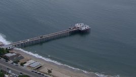 HD stock footage aerial video of approaching and orbiting Malibu Pier at sunset, California Aerial Stock Footage | CAP_018_053