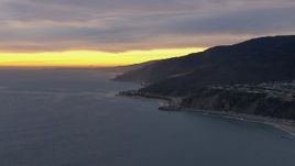 HD stock footage aerial video of a reverse view of Malibu at sunset, California Aerial Stock Footage | CAP_018_062