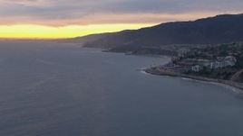 HD stock footage aerial video of flying away from Malibu at sunset, California Aerial Stock Footage | CAP_018_064