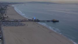 HD stock footage aerial video of flying over the beach toward Santa Monica Pier at sunset, California Aerial Stock Footage | CAP_018_065