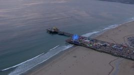 HD stock footage aerial video of an orbit of Santa Monica Pier at sunset, California Aerial Stock Footage | CAP_018_067