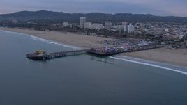 HD stock footage aerial video orbit Santa Monica Pier and Ferris wheel at sunset, California Aerial Stock Footage | CAP_018_068