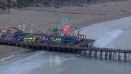 HD stock footage aerial video of the Ferris wheel at Santa Monica Pier at sunset, California Aerial Stock Footage | CAP_018_070