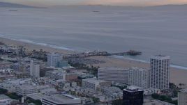 HD stock footage aerial video of a wider orbit of Santa Monica Pier at sunset, California Aerial Stock Footage | CAP_018_073