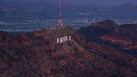 HD stock footage aerial video of zooming closer to the Hollywood Sign at sunset, California Aerial Stock Footage | CAP_018_078