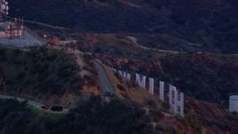 HD stock footage aerial video of orbiting the back of the Hollywood Sign at sunset, California Aerial Stock Footage | CAP_018_079