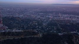 HD stock footage aerial video of panning across the city, seen from Hollywood Hills at sunset, California Aerial Stock Footage | CAP_018_080