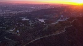 HD stock footage aerial video of a view of the city while orbiting radio towers atop Hollywood Hills at sunset, California Aerial Stock Footage | CAP_018_081