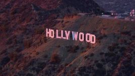 HD stock footage aerial video of orbiting the famous Hollywood Sign at sunset, California Aerial Stock Footage | CAP_018_083