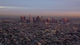 HD stock footage aerial video of a wide view of the Downtown Los Angeles skyline at sunset, California Aerial Stock Footage | CAP_018_087
