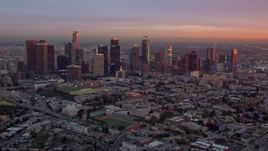 HD stock footage aerial video of flying by the Downtown Los Angeles skyline at sunset, California Aerial Stock Footage | CAP_018_089