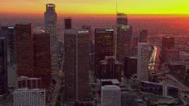 HD stock footage aerial video of passing by the Downtown Los Angeles skyscrapers at sunset, California Aerial Stock Footage | CAP_018_091