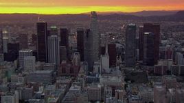 HD stock footage aerial video of flying by US Bank Tower and Downtown Los Angeles skyscrapers at sunset, California Aerial Stock Footage | CAP_018_094