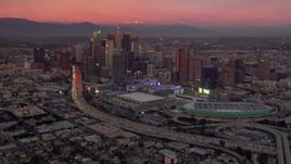 HD stock footage aerial video of Downtown Los Angeles skyscrapers, arena and convention center at sunset, California Aerial Stock Footage | CAP_018_099