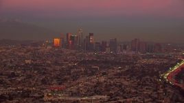 HD stock footage aerial video of a wide view of the Downtown Los Angeles skyline at sunset, California Aerial Stock Footage | CAP_018_104