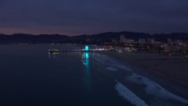 HD stock footage aerial video of slowly approaching Santa Monica Pier at twilight, California Aerial Stock Footage | CAP_018_106