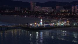 HD stock footage aerial video of orbiting Santa Monica Pier and Ferris wheel at twilight, California Aerial Stock Footage | CAP_018_108