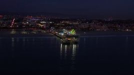HD stock footage aerial video of flying toward Santa Monica Pier and Ferris wheel at twilight, California Aerial Stock Footage | CAP_018_109