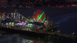 HD stock footage aerial video orbit and fly away from Ferris wheel at twilight, Santa Monica Pier, California Aerial Stock Footage | CAP_018_111