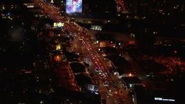 HD stock footage aerial video of following the Sunset Strip at night in West Hollywood, California Aerial Stock Footage | CAP_018_129