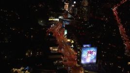 HD stock footage aerial video of flying over the Sunset Strip at night in West Hollywood, California Aerial Stock Footage | CAP_018_130