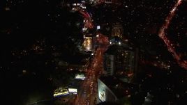 HD stock footage aerial video of light traffic on the the Sunset Strip at night in West Hollywood, California Aerial Stock Footage | CAP_018_131