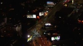 HD stock footage aerial video of light traffic traveling the Sunset Strip at night in West Hollywood, California Aerial Stock Footage | CAP_018_133