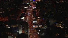 HD stock footage aerial video fly above Sunset Strip billboards and traffic at night in West Hollywood, California Aerial Stock Footage | CAP_018_141