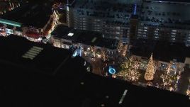 HD stock footage aerial video of circling Christmas decorations and fountain at The Grove shopping mall at night in Los Angeles, California Aerial Stock Footage | CAP_018_164